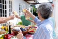 Caucasian family sitting at table during a family lunch in the garden Royalty Free Stock Photo