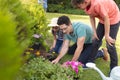 Caucasian family spending time together in the garden, planting Royalty Free Stock Photo