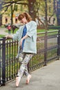 Caucasian fashion ballerina walking in the park