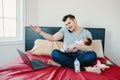 Caucasian father dad with newborn mixed race Asian Chinese baby working from home