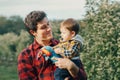 Caucasian father hugging playing with baby boy. Royalty Free Stock Photo