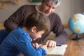 Caucasian father and son doing mathematics homework Royalty Free Stock Photo
