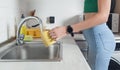 Female hand pouring water in cup