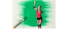 Caucasian Female Handball Player Against Green Paint Stain And Paint Brush On White Background