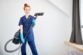 Floor care and cleaning services with vacuume cleaner at hotel room