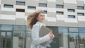 Caucasian female office worker rushing on her business with folders. Pretty woman business worker. Job, activity Royalty Free Stock Photo