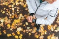 Caucasian female runner starting activity on smartwatch. Woman monitoring a heart rate on her watch outdoors. Top view with yellow