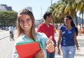 Caucasian female student with friends in the city Royalty Free Stock Photo