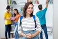 Caucasian female student with group of students Royalty Free Stock Photo