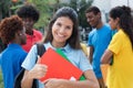 Caucasian female students showing thumb with other international Royalty Free Stock Photo