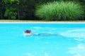 Caucasian female swimmer doing laps in a pool Royalty Free Stock Photo