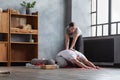 Caucasian female yoga teacher helping to stretch muscles her student. Royalty Free Stock Photo