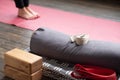 Caucasian females legs on yoga mat with yoga props