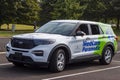 A caucasian first responder is waiting inside a Ford interceptor paramedic car Royalty Free Stock Photo