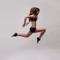 Caucasian fitness woman jumping