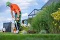 Caucasian Garden Owner and the Lawn Edger Job Royalty Free Stock Photo