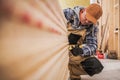 General Construction Contractor Worker Counting Pieces of Drywall Boards Royalty Free Stock Photo