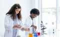 Girl and boy studying science at school