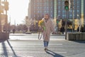 Caucasian girl crosses a large road at a pedestrian crossing at a green traffic light. . Traffic safety Royalty Free Stock Photo