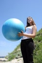 Caucasian girl with fitness ball Royalty Free Stock Photo