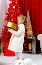 Caucasian girl holding a box in her hands. Christmas and New Year concept. Surprises and gifts Royalty Free Stock Photo