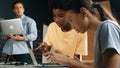 Girl programing or coding system while african boy fixing model. Edification. Royalty Free Stock Photo