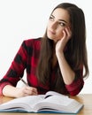 Caucasian girl studying for her exams at home, education concept on white background Royalty Free Stock Photo