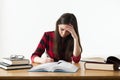 Caucasian girl studying for her exams at home, education concept on white background Royalty Free Stock Photo