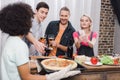 caucasian girl taking photo of african american friends pizza Royalty Free Stock Photo
