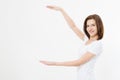 Caucasian girl in tshirt isolated on white background showing copy space by hands. European young woman. Mock up