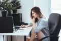 Caucasian girl woman student in pajamas shirt working on laptop computer Royalty Free Stock Photo