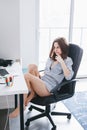 Caucasian girl woman student in pajamas shirt working on laptop computer Royalty Free Stock Photo