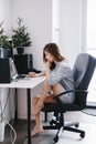 Caucasian girl woman student in pajamas shirt working on laptop computer Royalty Free Stock Photo