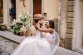 Interracial wedding couple. Wedding in Florence, Italy. Caucasian groom circling African-American bride.