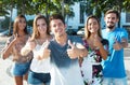 Caucasian guy with hispanic and latin men and woman showing thumb up Royalty Free Stock Photo