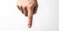 Isolated image of a caucasian hand pointing down on a plain white background Royalty Free Stock Photo
