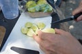 Caucasian hands cutting lime for mojito Royalty Free Stock Photo