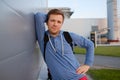 Caucasian handsome man in casual clothes with a friendly smile leaning against wall Royalty Free Stock Photo