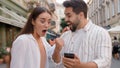 Caucasian happy couple enjoy excited man woman shocked lucky success victory mobile phone smartphone reading message Royalty Free Stock Photo