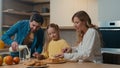 Caucasian happy family at kitchen morning breakfast with food delivery service parents mother father with child daughter Royalty Free Stock Photo