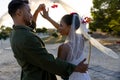 Caucasian happy newlywed young couple dancing at beach at wedding ceremony during sunset Royalty Free Stock Photo