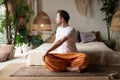 Caucasian healthy young man doing yoga Spine twisting pose for spine