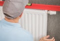Heating Radiator Installation with Spirit Level Tool Royalty Free Stock Photo