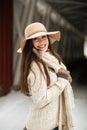 Caucasian High School Senior Smiling in Knit Winter Clothes and Floppy Hat