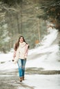 Caucasian High School Senior Walking Down Snowy Path