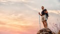 Caucasian hiker feel happy with his success to achieve climbing up mountain with sunset view