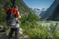 Caucasian Hiker Taking Quick Look on a Scenic Kjenndal Glacier Valley