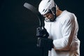 Caucasian hockey player, in uniform, isolated on black, prays for good luck.