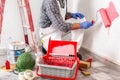 Professional house painter at work painting the wall Royalty Free Stock Photo