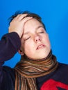 Caucasian ill boy dressed with neckscarf